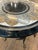 Elegant inlaid mixed marble top round side table in earth colors with central black circle, having gorgeous swan motif...