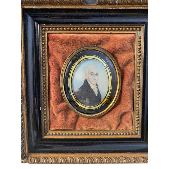 A miniature rustic framed oil on board painting of an english gentleman wearing a frock coat and stiff collar, a fashion...