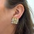 Garavelli signed geometric clip-on earrings featuring three-dimensional woven square design in 18K two-tone gold with 3.50...