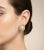 These vintage 1980s Italian clip-on earrings are a quintessential example of decadent late-century glamour, featuring a...