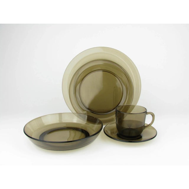 Vintage 1970s Vereco smoke brown glass dinnerware set made in France. This 40 piece set includes 8 5-piece place settings....