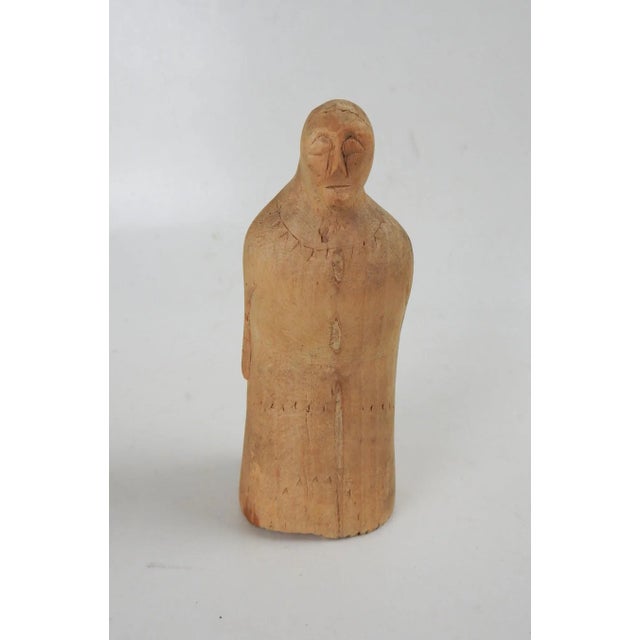 Vintage hand carved wood figure. Woman with closed eyes, braids down her back, pleated robe in back with faint stamped...