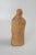 Vintage hand carved wood figure. Woman with closed eyes, braids down her back, pleated robe in back with faint stamped...