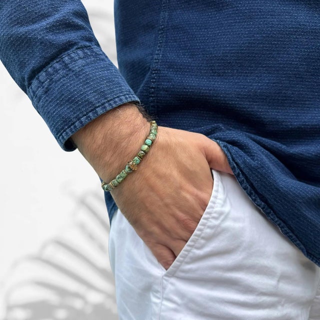 The King Skull Turquoise Stone Good Fortune Beaded Bracelet's unique features, design aspects, and its blend of symbolism...