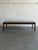 Danish Mid-Century Modern coffee table crafted in rich rosewood, showcasing stunning natural grain and timeless...