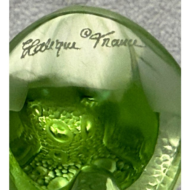 Frosted Lalique Crystal frog figurine in lime green. The bottom is signed Lali France. No chips or cracks noted. It stands...