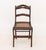 Victorian Mahogany Side Chair, carved floral crest and caned seat on four down swept legs conjoined by box stretcher. 33"...