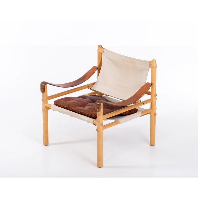 Safari chair model Sirocco in good condition. Original leather and canvas. Designed by Arne Norell, produced by Arne...