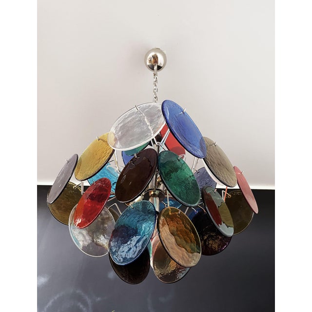 Vintage Italian Murano chandelier in Vistosi style. The chandelier has 36 fantastic multicolored discs in a nickel metal...