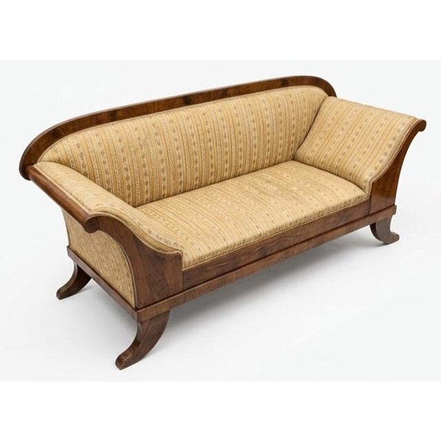This is a Biedermeier-style sofa, a distinctive type of Central European furniture that grew highly popular between 1815...