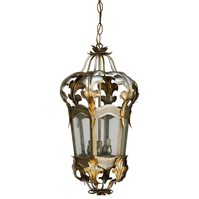 A Lovely Antique Italian Tole Hanging Lantern in The Louis XVI style. Three light sockets and glass panels.
