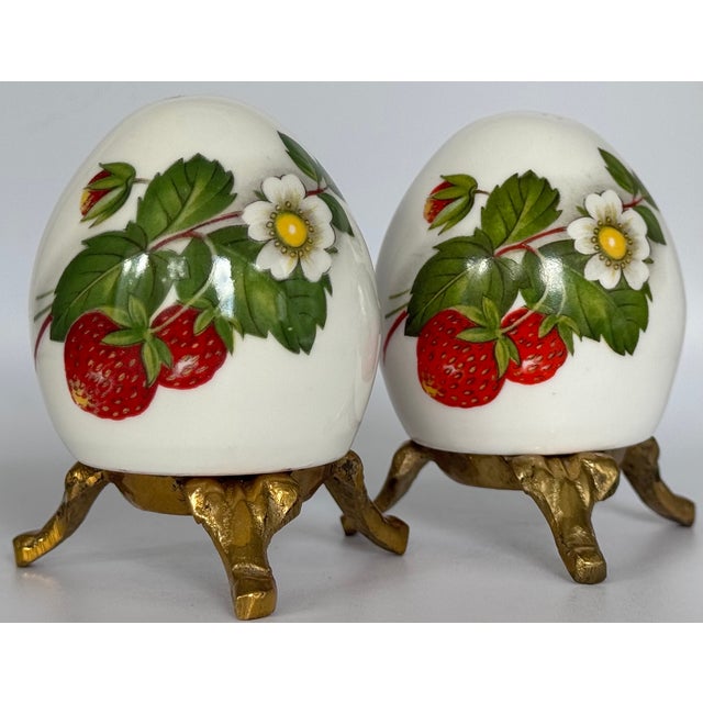 Presenting a unique vintage find in the form of bone china strawberry motif salt and pepper. Egg shaped shakers rest upon...