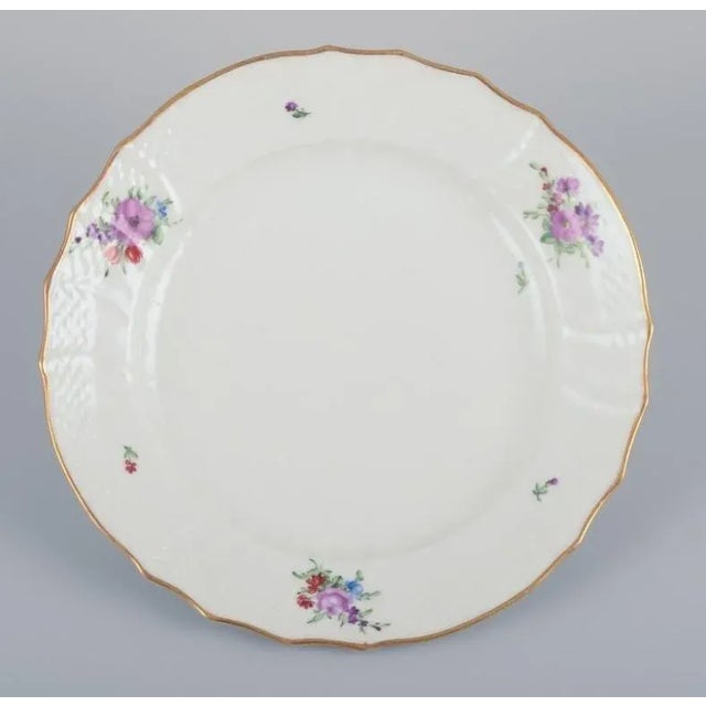 Royal Copenhagen Saxon Flower. Six lunch plates in porcelain. Hand-painted with polychrome flowers. Gold rim. Model:...