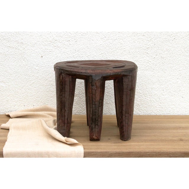 A unique piece of African art, this vintage Nupe table from Nigeria is a must-have for collectors and enthusiasts of Nupe...