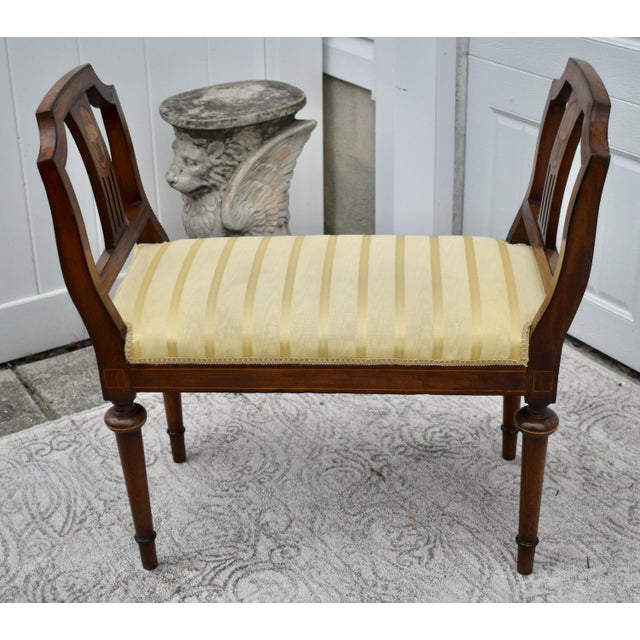 Antique (1910's) DBL. Arm Bench has a Regency Style. The Wood is Walnut. Carved and Inlaid. Gold Striped Fabric. Strips...