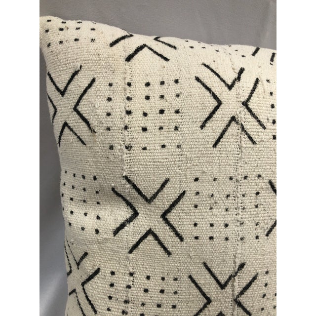 Mud cloth is made in Mali Africa. It is constructed of hand-spun cotton strips. The fabric is then dyed in a bath made of...