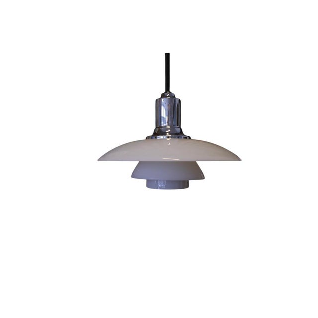 A beloved design classic designed by poul henningsen for louis poulsen in denmark. The ph 2/1 is the smallest pendant in...