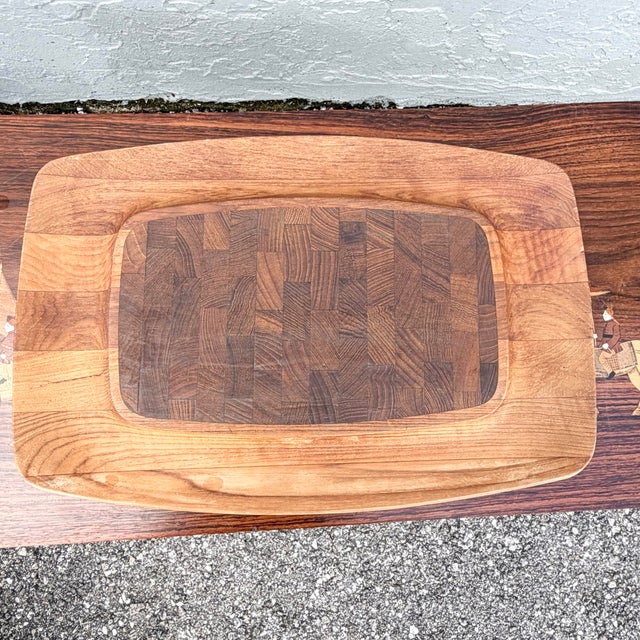 Designed by Jens Harald Quistgaard for Dansk, this vintage cutting board and serving tray celebrates Scandinavian modern...