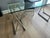 Glass and chrome trestle desk purchased from Cantoni in Dallas. The clear glass top and sawhorse-style supports create an...