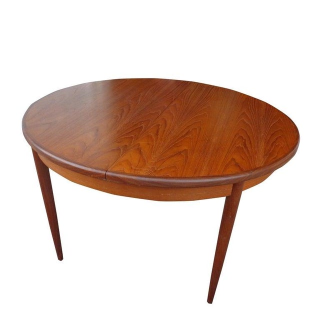 G Plan teak dining table Mid-Century Modern G Plan round 48" dining table with a rich teak grain. Butterfly extension leaf...