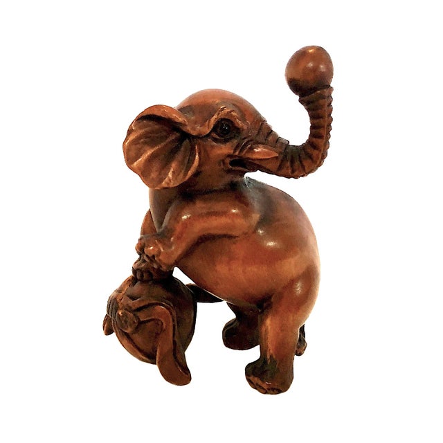 This fascinating collection displays three distinct elephant miniatures intricately hand-carved of boxwood (Tsuge) in...