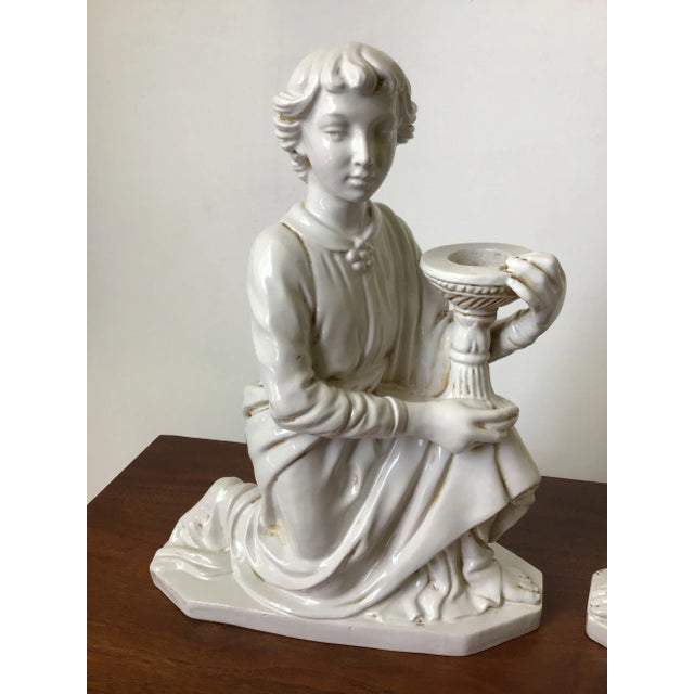 This is one of the most beautifully sculpted pair of candle holders I have seen. They are signed Italian pottery by...