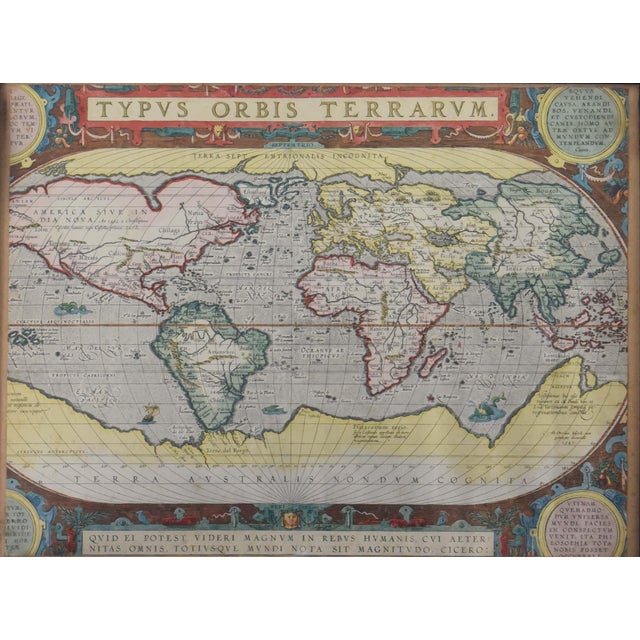 This is a framed, high-quality reproduction of Abraham Ortelius's iconic world map, Typus Orbis Terrarum, which first...
