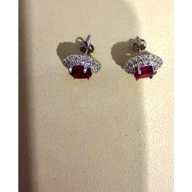 Modern 6 Ct Oval Treated Ruby & 2 Ct Double Halo Diamond Stud Earrings 14k White Gold For Sale - Image 3 of 8