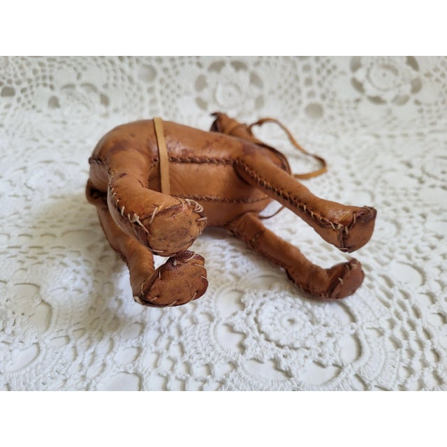 A brown camel with the most charming and whimsical details. It measures 7 1/2" x 2 1/2" x 5". It would look wonderful...