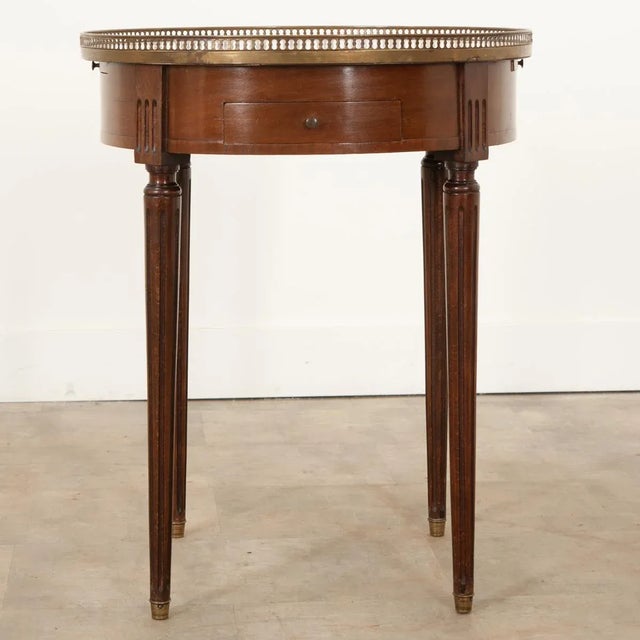 A charming French mahogany gueridon/bouillotte table originally used for playing the popular card game. Topped with white...