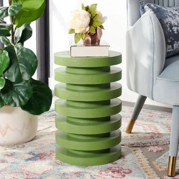 Add an eye-catching accent to your living area with our Kaysar Accent Table. Stacks of discs float onto each other to...