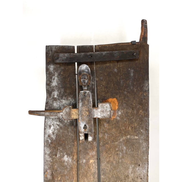 An art object * A Bambara/Bamana door * from Mali, Africa * Made of wood * A typical Bambara crossbolt lock is located in...