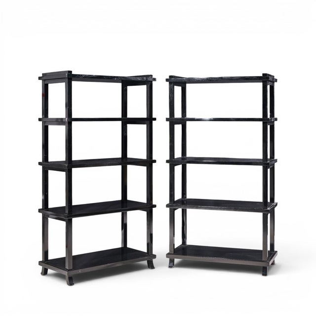 Baker Black Lacquered Etagere Shelves - Pair Each etagere measures: 40 wide x 20 deep x 74.5 inches high Good Vintage...