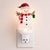 Add a sprinkle of holiday magic to your home with the Snowman with Present Snow Globe Night Light. Standing 7 inches tall,...