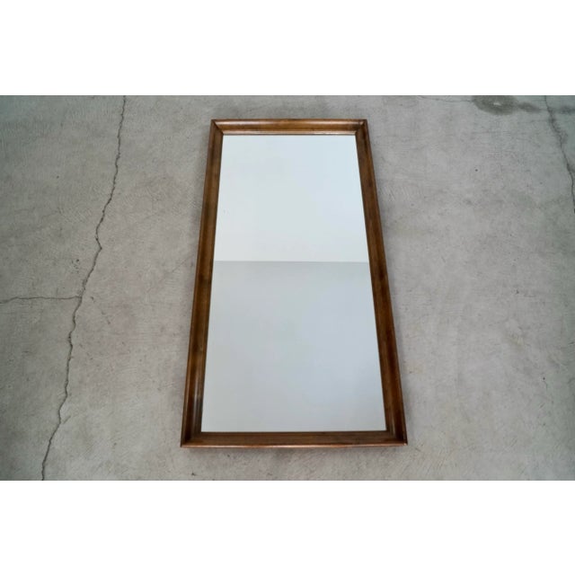 Vintage Midcentury Modern mirror for sale. Dates back to 1967. Made of solid mahogany in a walnut finish. Has a great...
