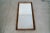 Vintage Midcentury Modern mirror for sale. Dates back to 1967. Made of solid mahogany in a walnut finish. Has a great...