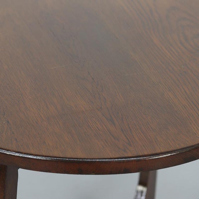 Art Deco oak side table, dating from the 1930s. Distinctive organic design with a decorative appearance. The table is...