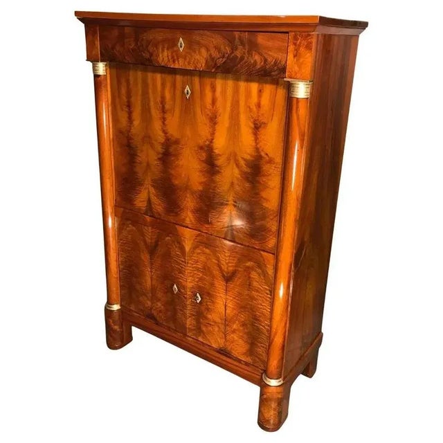 This elegant early 19th-century Empire-Biedermeier secretary desk was crafted in Germany between 1810 and 1820. It...