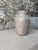Striking handcrafted ceramic vase featuring a rich Oaxaca Tibon glaze finish with beautiful tonal movement, natural...