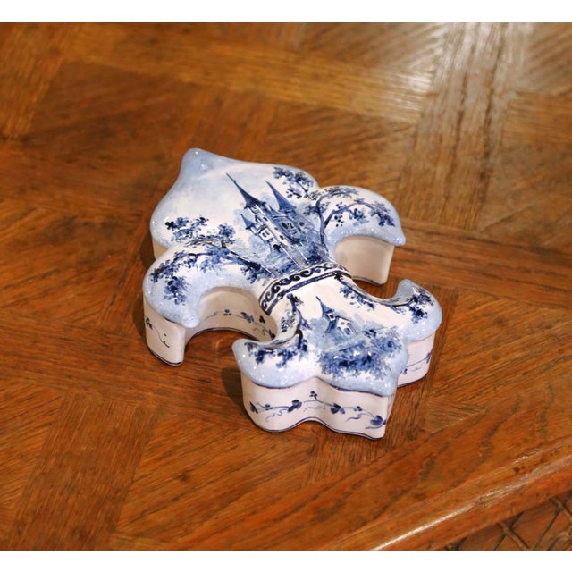 Dress a console or vanity with this charming antique French faience box shaped as a fleur-de-lys. Crafted in France in the...