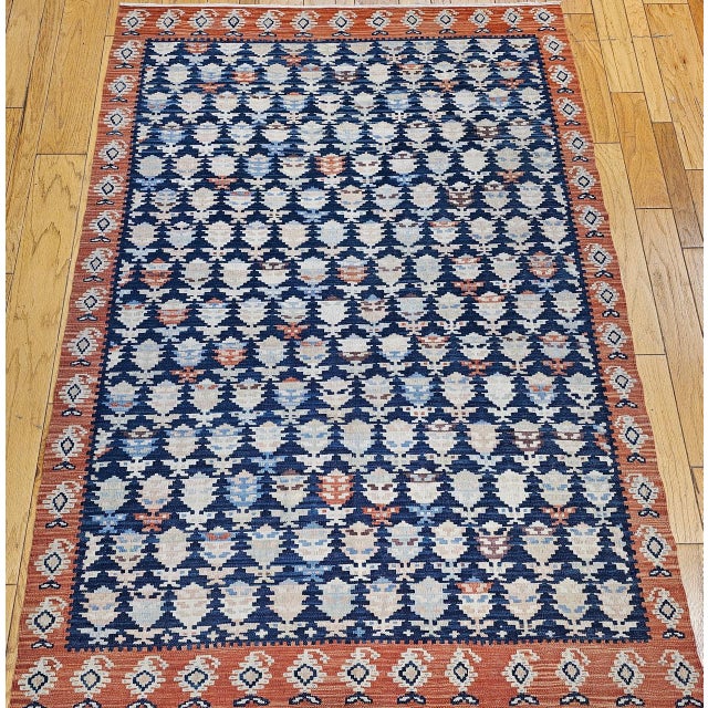 This Vintage Persian Kurdish Kilim Rug is in an all-over paisley (boteh) pattern. Hand-woven in wool, this room-size...