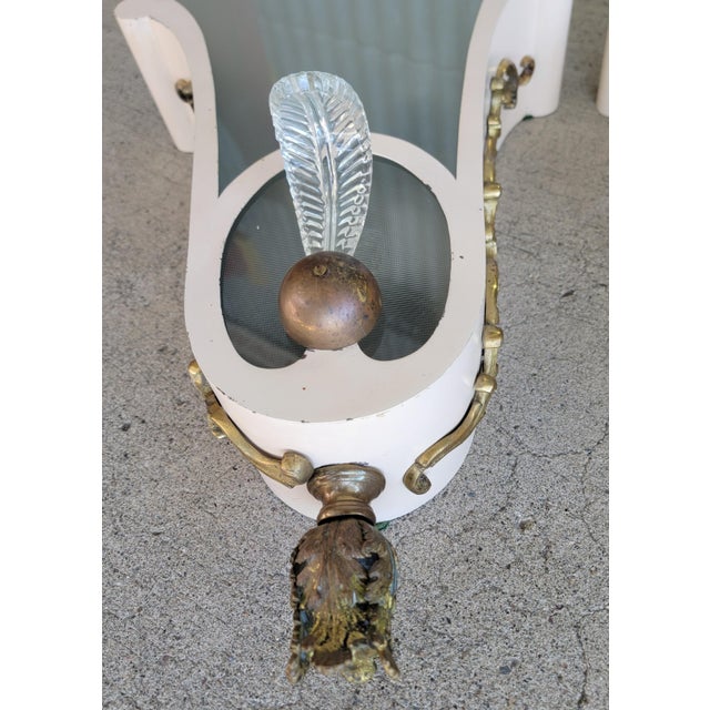 A pair of movie theater wall sconces. Painted metal frames with brass mounts and glass panel. Each sconce will hold 4...