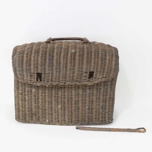 This vintage wicker picnic basket is a charming handwoven piece, perfect for adding a rustic touch to your spring picnic...