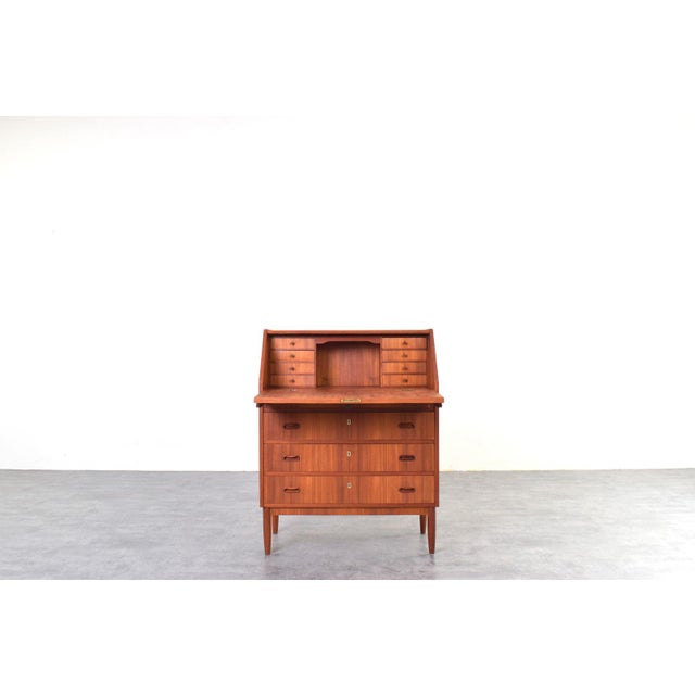 This Danish cabinet from the 1960s is an example of Mid-Century Modern design, which emphasized proportion, functionality,...