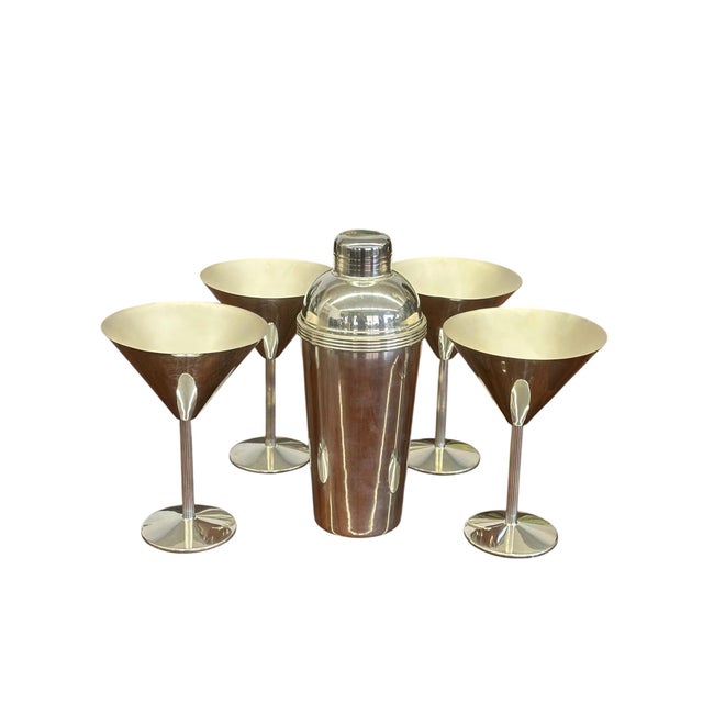 A rare and discontinued silver-plated cocktail shaker and martini glass set by Christofle Paris, designed in collaboration...