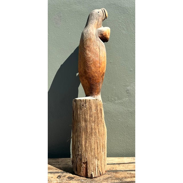 This monumental vintage walrus sculpture is a remarkable example of hand-carved folk art, exuding a playful yet...