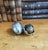 An antique cold painted inkwell featuring a small bird in a silver metal eggshell. The shell with cracked design is...