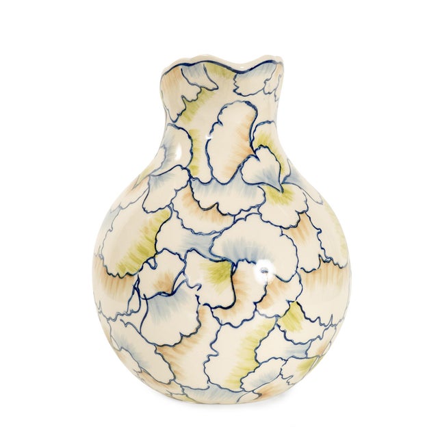 . Its curvy silhouette and flowing spout bring graceful movement to any table, while the whimsical botanical pattern adds...