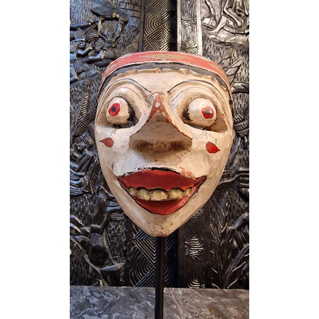 Topeng mask from the island of Bali. This hand-carved mask is used in Topeng theatre, a performance art form combining...