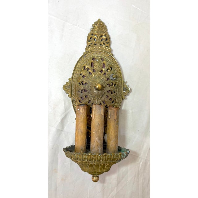 Up for sale is an exquisite antique Victorian wall sconce fixture made of thick gold gilded bronze. Its intricate design...